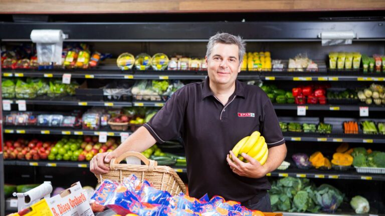 Worker in grocery store.